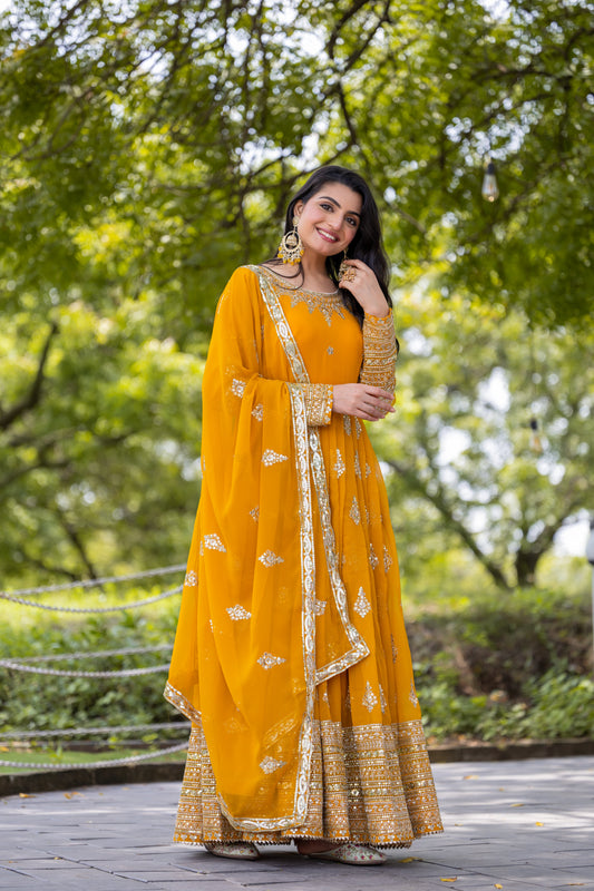 Luminous Mustard Yellow Faux Georgette Sequins Embroidered Anarkali Suit