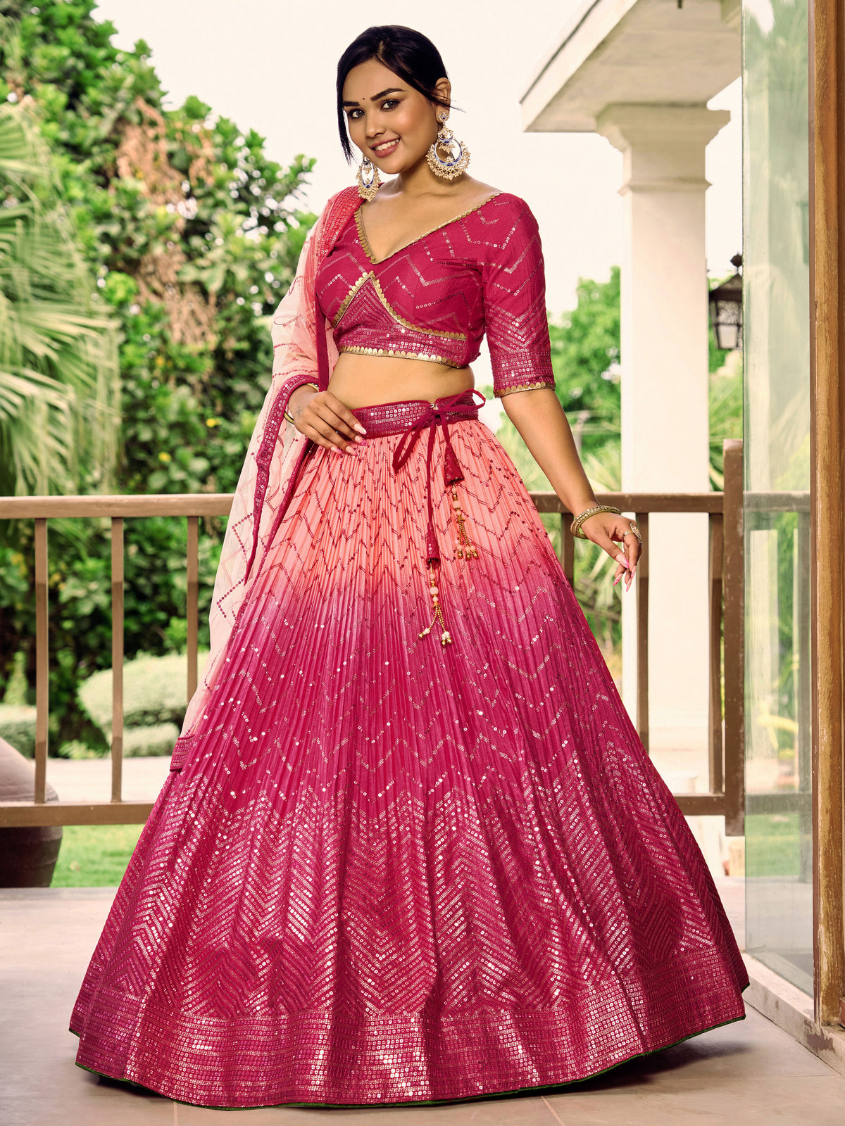 Rani Pink Lehenga Choli with Gold Chevron Work and Peach Dupatta