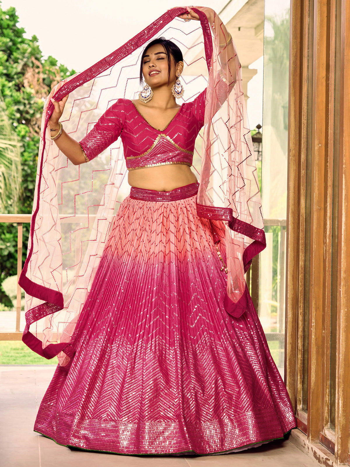 Rani Pink Lehenga Choli with Gold Chevron Work and Peach Dupatta