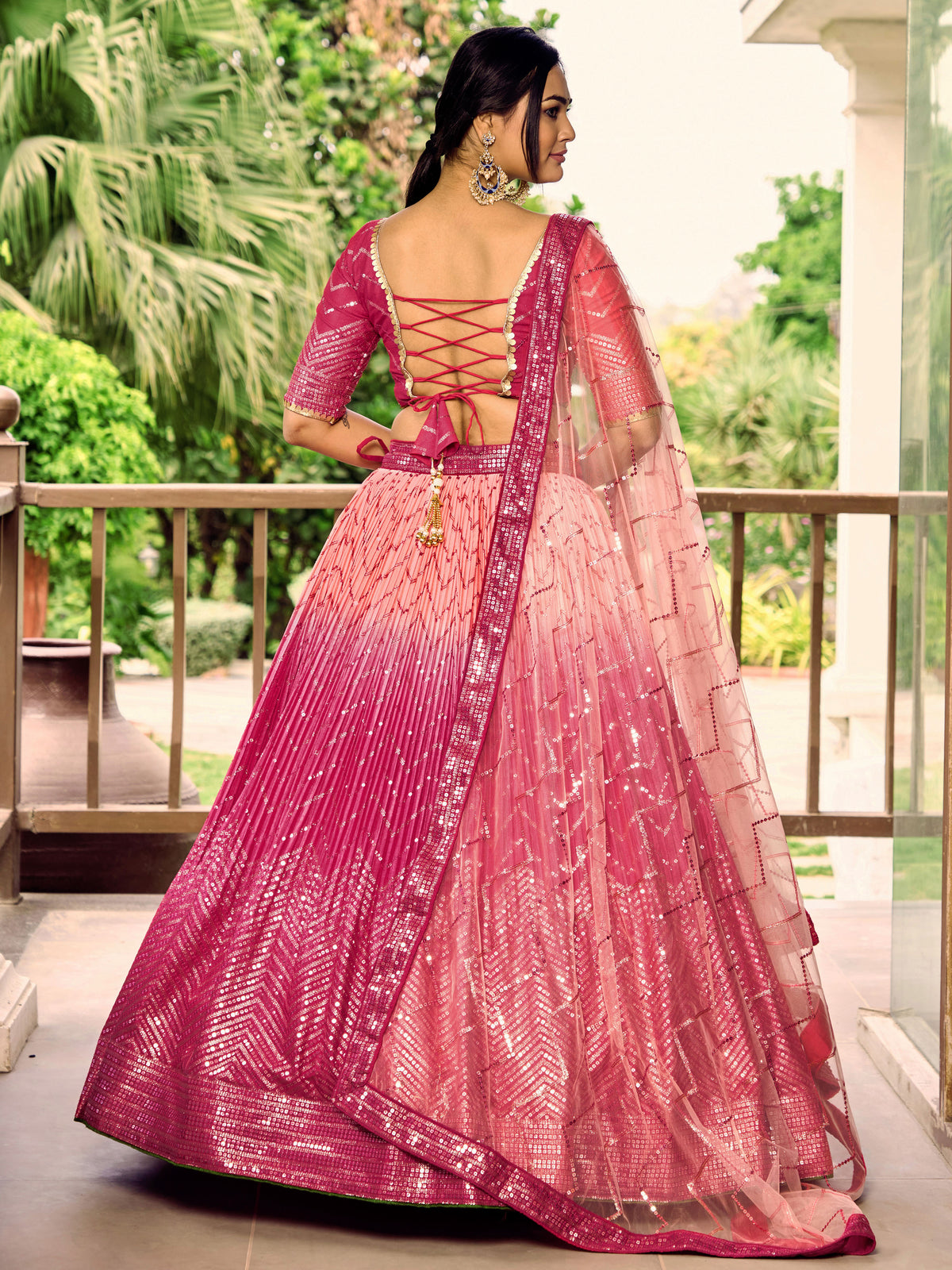 Rani Pink Lehenga Choli with Gold Chevron Work and Peach Dupatta