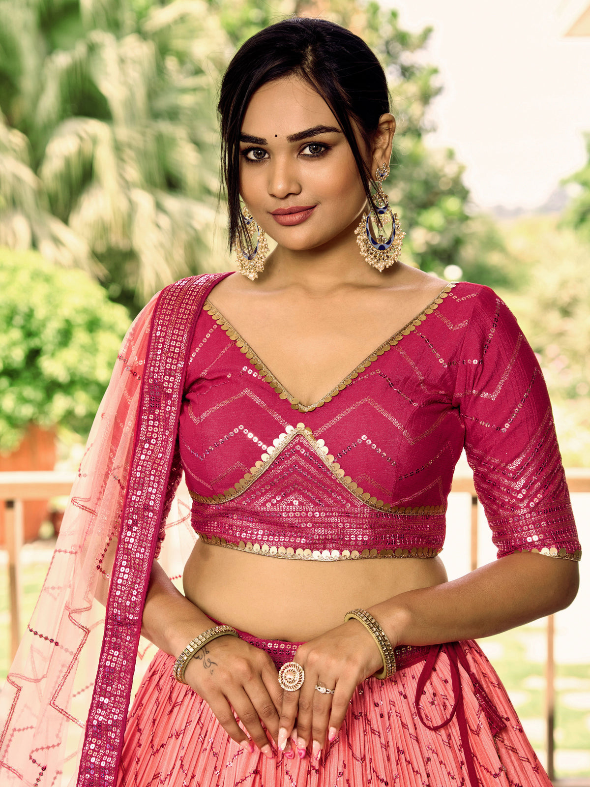 Rani Pink Lehenga Choli with Gold Chevron Work and Peach Dupatta