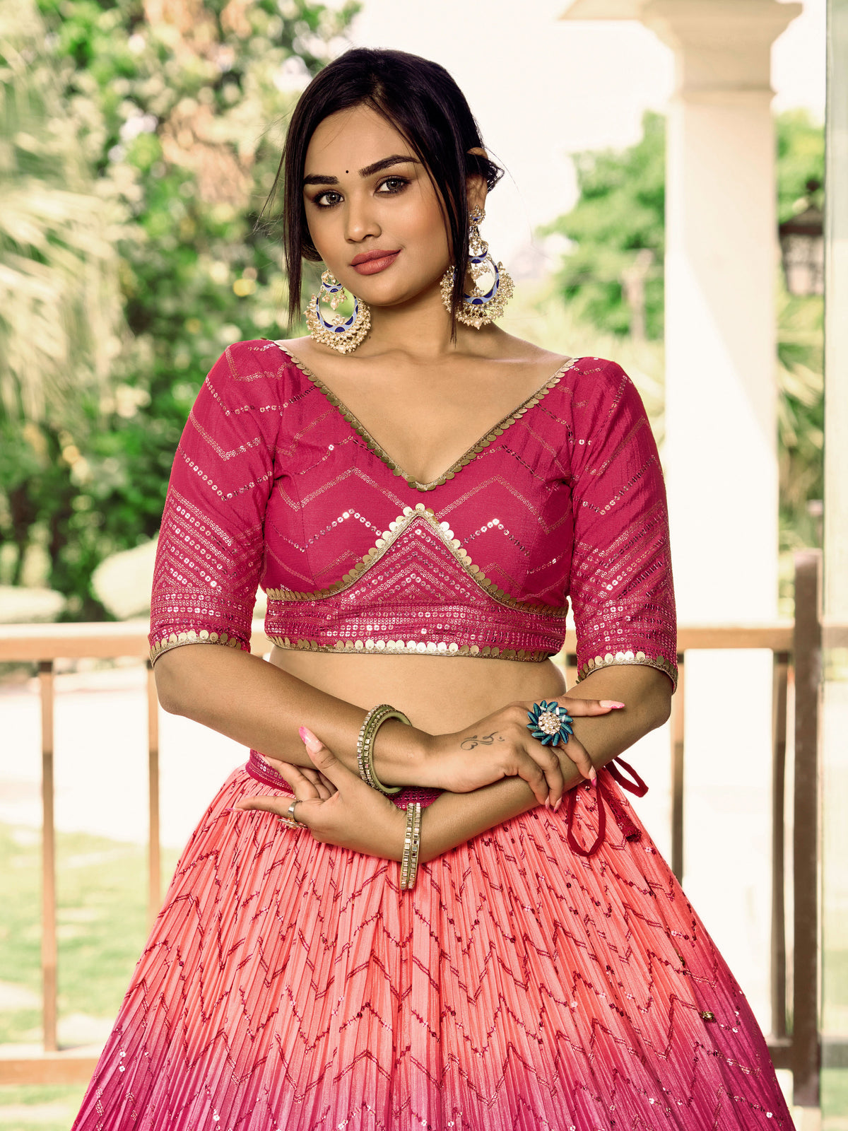 Rani Pink Lehenga Choli with Gold Chevron Work and Peach Dupatta