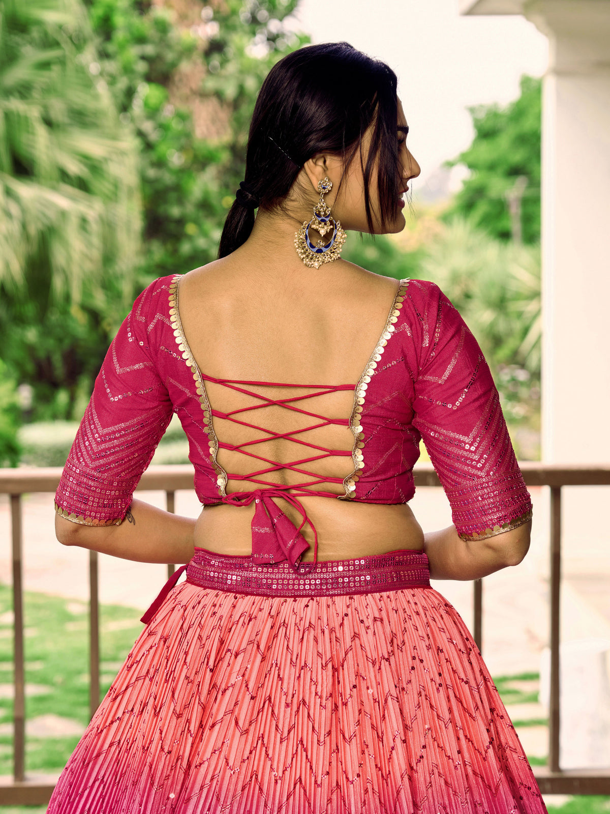 Rani Pink Lehenga Choli with Gold Chevron Work and Peach Dupatta