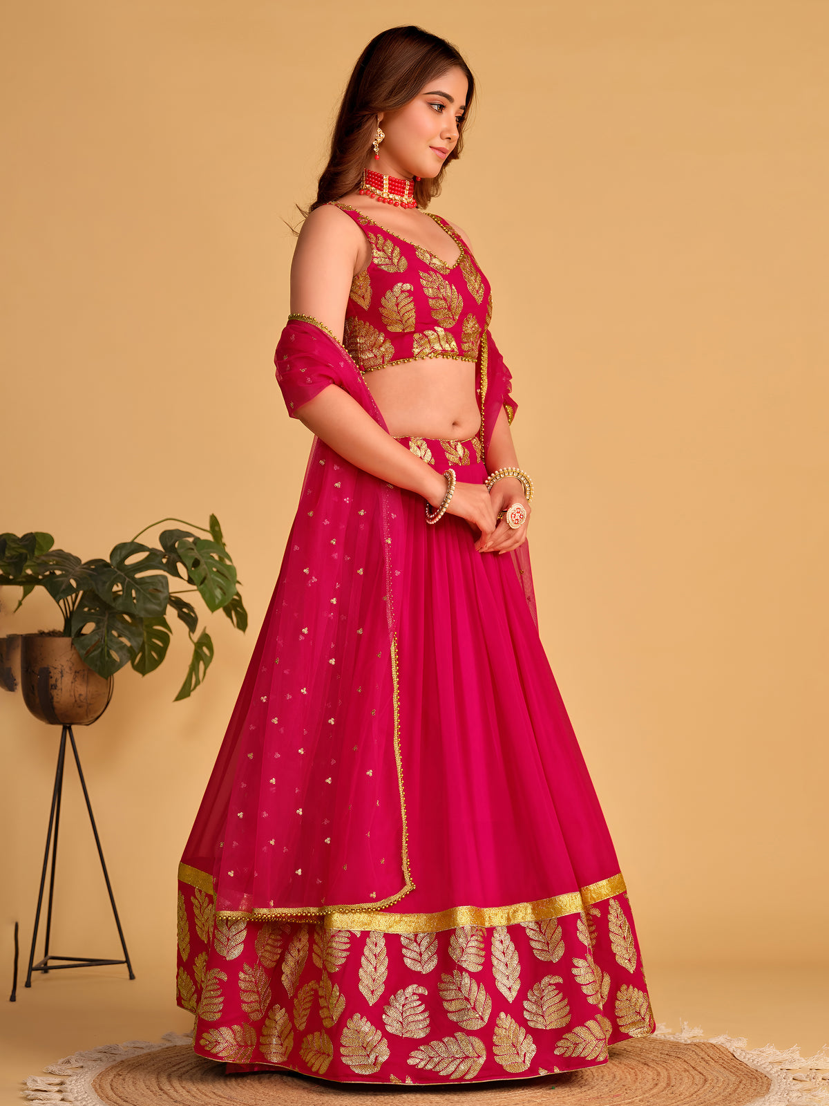 Rani Pink Lehenga Choli with Golden Leaf Embroidery and Designer Dupatta