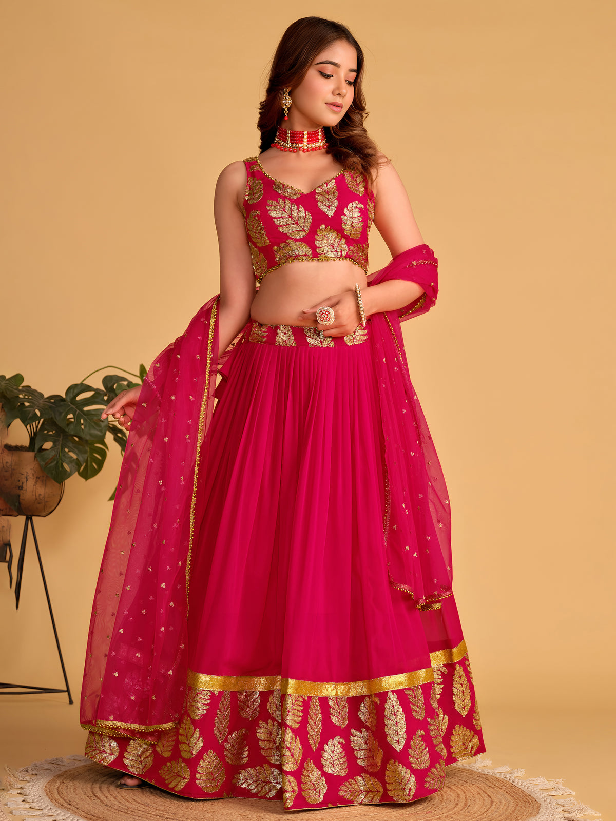 Rani Pink Lehenga Choli with Golden Leaf Embroidery and Designer Dupatta
