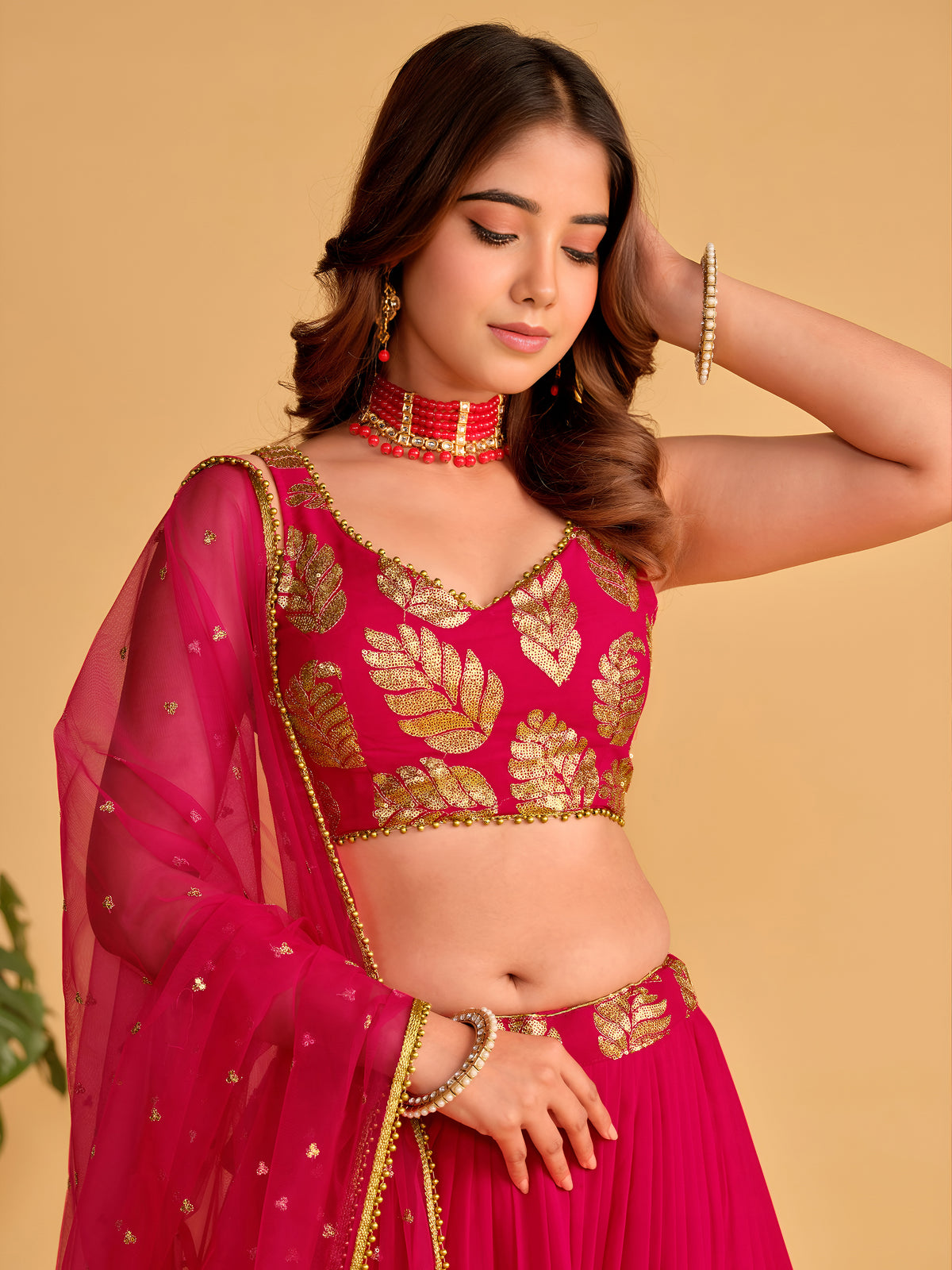 Rani Pink Lehenga Choli with Golden Leaf Embroidery and Designer Dupatta