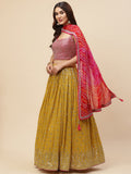 Mustard Yellow Bandhani Lehenga Choli with Pink Dupatta