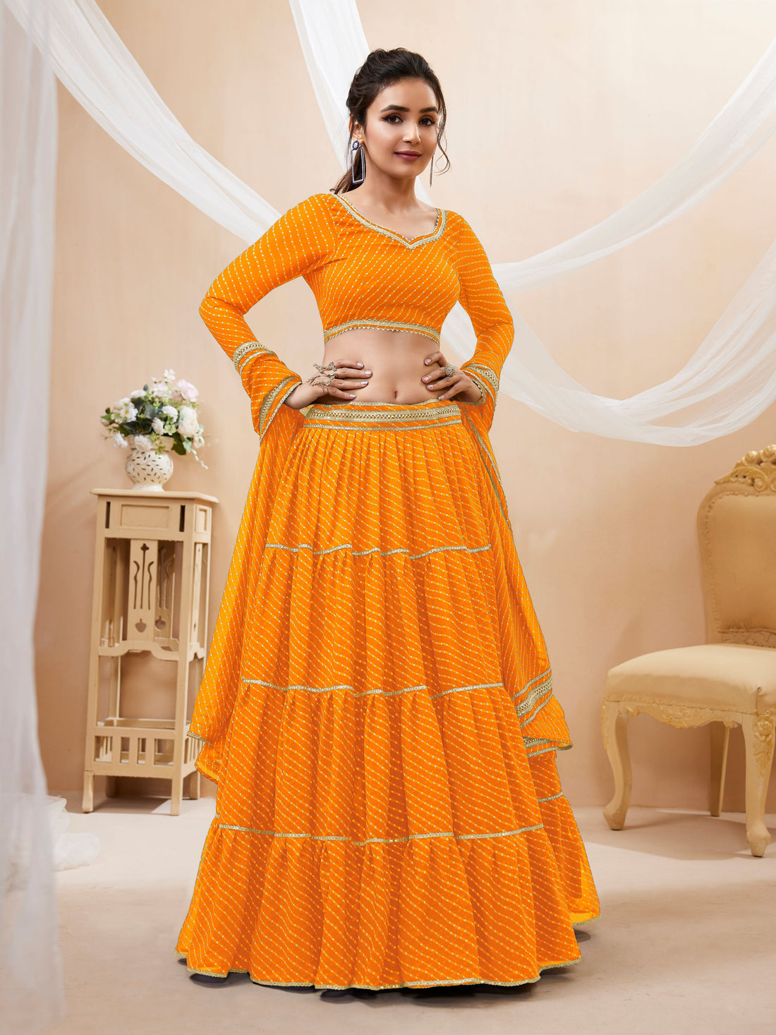 Bright Orange Tiered Lehenga Choli with Golden Lace