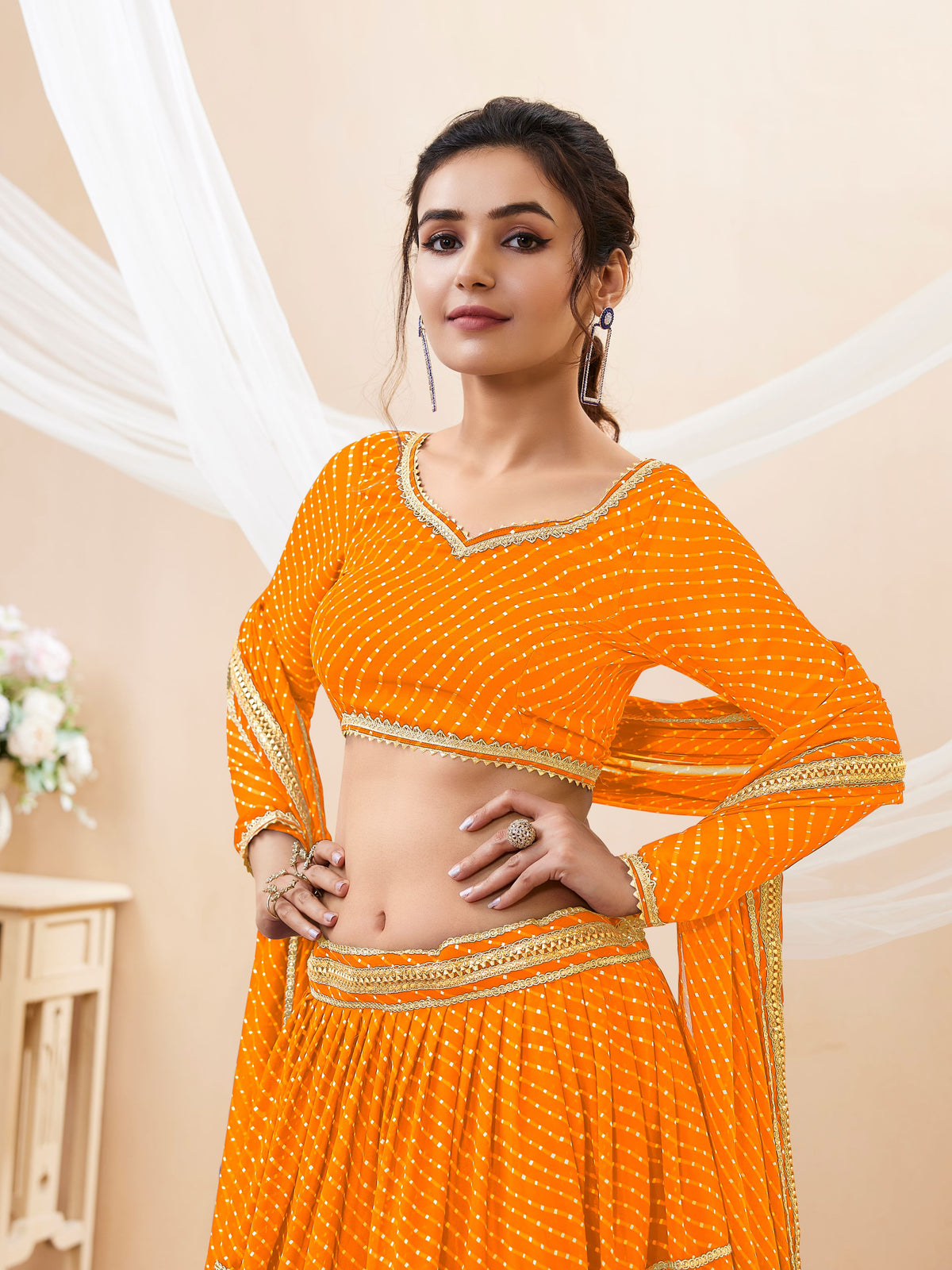 Bright Orange Tiered Lehenga Choli with Golden Lace
