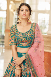 Teal Blue Bridal Lehenga Choli with Pink and Gold Floral Embroidery