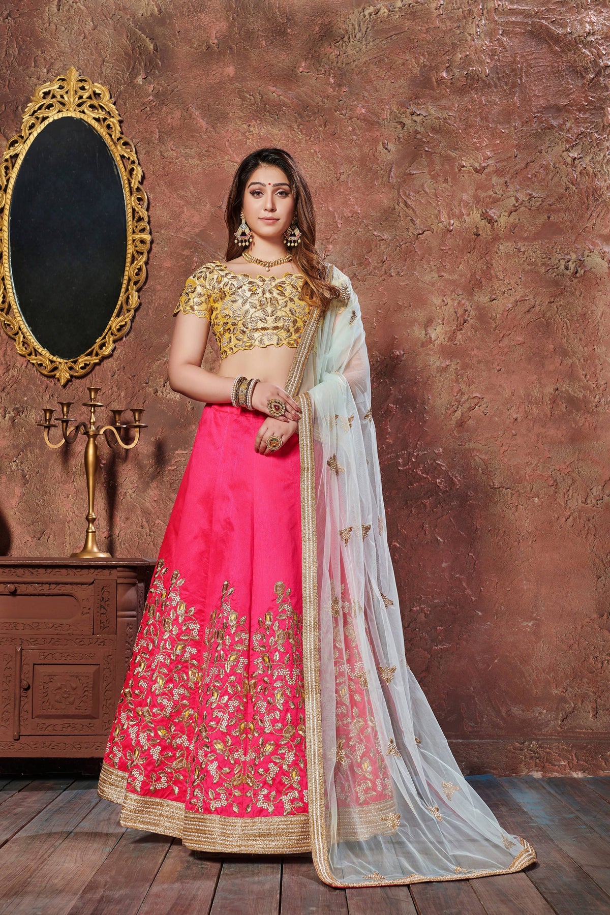 Hot Pink and Golden Embroidered Bridal Lehenga Choli with Ivory Dupatta