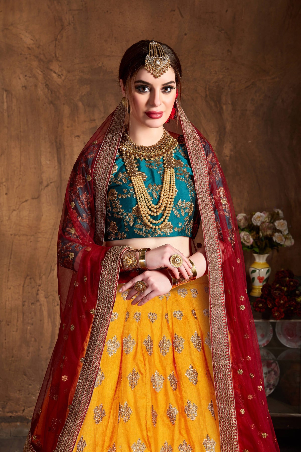 Mustard Yellow and Teal Embroidered Bridal Lehenga Choli with Red Dupatta