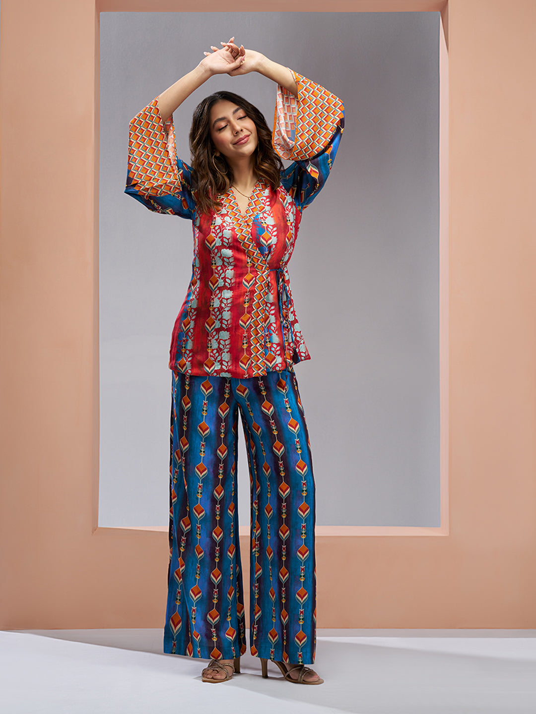 Multicolor printed co-ord set with a wrap-style top and wide-leg pants.
