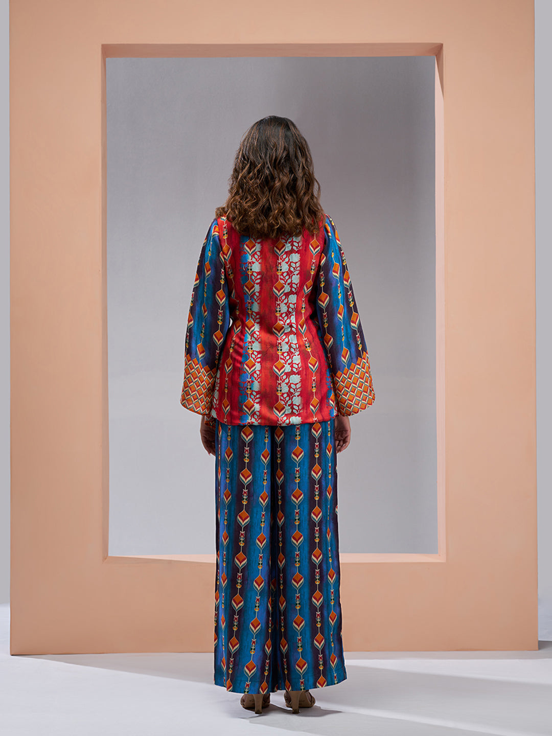 Multicolor printed co-ord set with a wrap-style top and wide-leg pants.