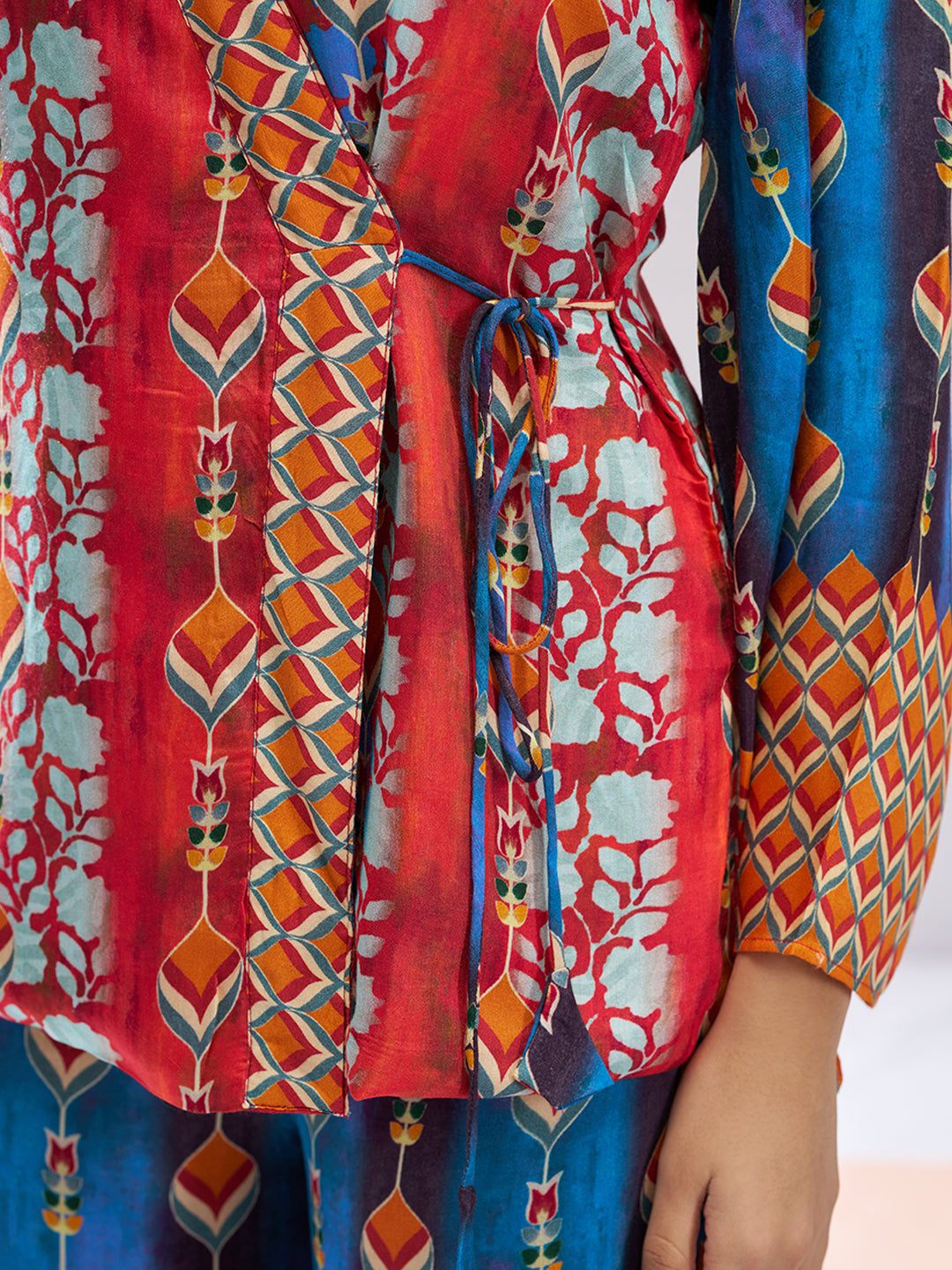 Multicolor printed co-ord set with a wrap-style top and wide-leg pants.