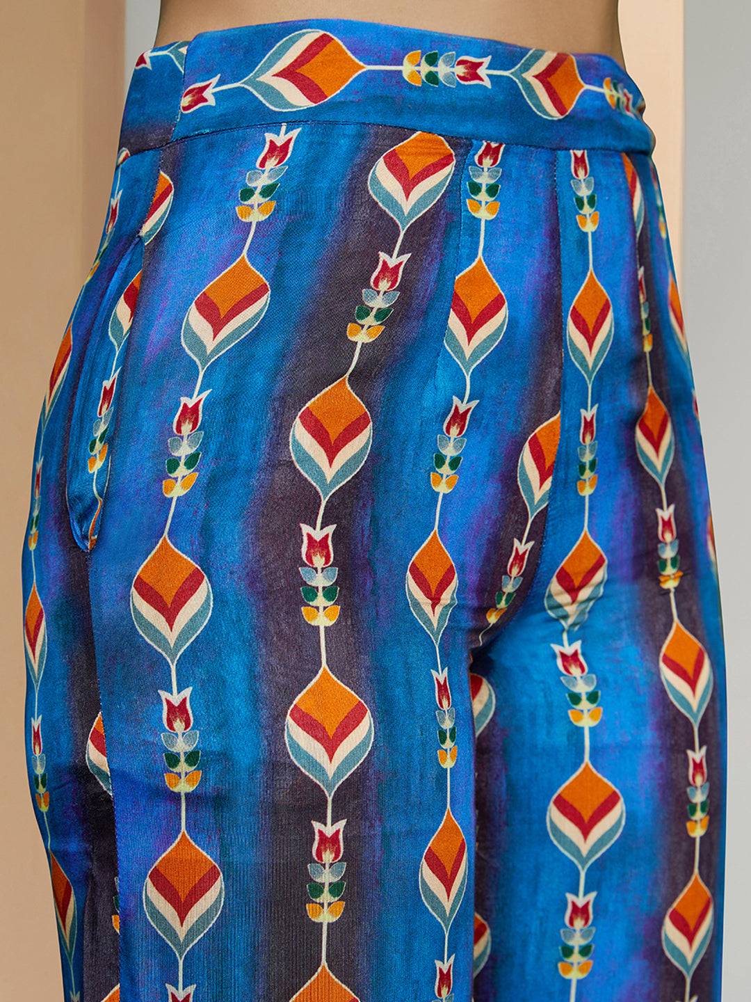 Multicolor printed co-ord set with a wrap-style top and wide-leg pants.