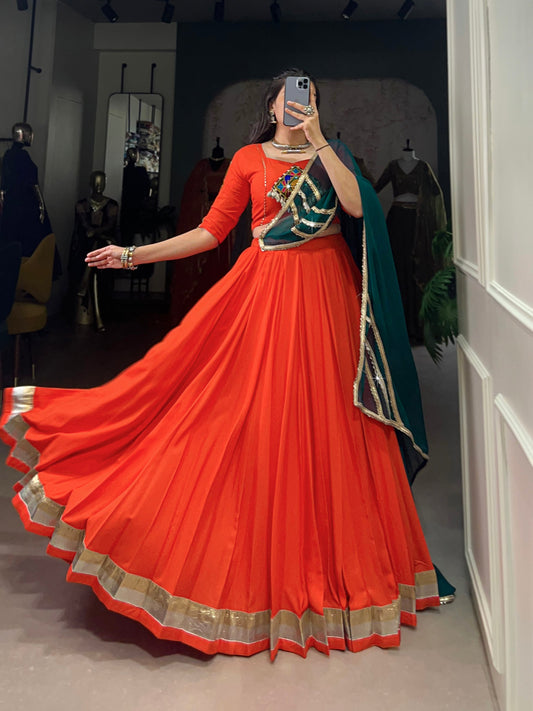 Magnificent Orange Pure Rayon Embossed Navratri Lehenga Choli