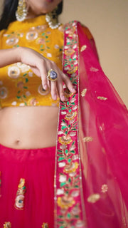 Rani Pink Lehenga Choli with Yellow Blouse and Floral Embroidered Dupatta